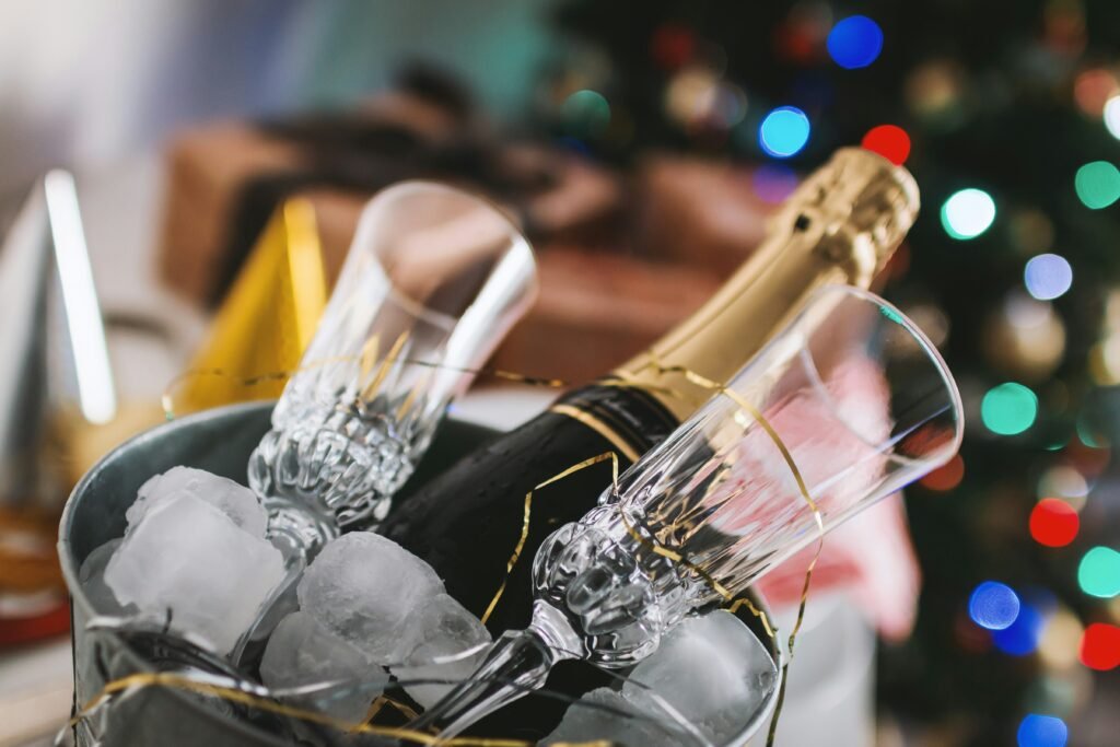 Champagne and champagne flutes in a bucket of ice